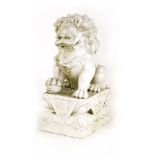 A marble Chinese guardian lion, 48cm high
