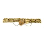 A gold five row gate link bracelet, a pierced floral bar between two pairs of banded links with