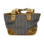 A Coach handbag, stripe denim with brown suede detailing, gold-tone hardware and zip fastening, with