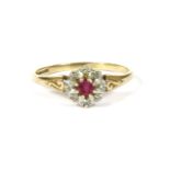 A 9ct gold ruby and diamond cluster ring, 1.58g