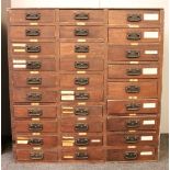 A Victorian grained pine seed merchant's cabinet, with 29 drawers, 97cm wide, 53cm deep, 100cm high.