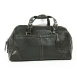 A Coach black leather tote handbag, two exterior pockets, with contrast coloured stitching, silver-
