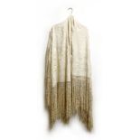 A 19th century cream silk piano shawl, embroidered design, with macramé tassel edging