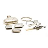 A mixed lot of silver, to include a hammered hip flask, a 21st birthday key brooch engraved 'Cafe de