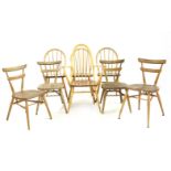 A post war Ercol Quaker elbow chair, together with three similar, and four stacking chairs (8)