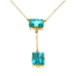 A two stone blue paste stone Edna May pendant, suspended on a gold trace chain 3.90g