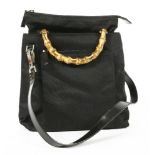 A Gucci black canvas handbag, with bamboo handles and leather strap, with dust bag