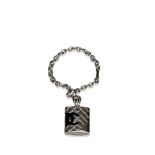 A Chanel chain charm bracelet with quilted handbag charm , a silver chain with an engraved charm
