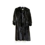 A black mink fur coat, with a short collar and cuff sleeves