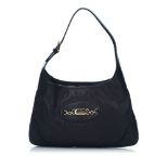 A Gucci Guccissima Leather Punch Hobo handbag, featuring a leather body, flat leather strap,