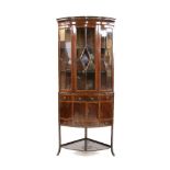 An Edwardian mahogany crossbanded bow front cabinet, with upper bar glazed door, height 174cm