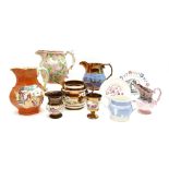A collection of copper lustreware, including jugs, goblets, a Sunderland `lustre' plaque `Thou God