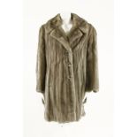 A mink fur coat, with single breasted button up coat