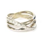 A 9ct white gold diamond set three row band ring marked 0.13 assumed estimated diamond weight, 3.