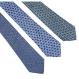 Three Hermès silk ties, to include a blue silk ground tie with a printed pineapple design, a blue
