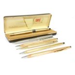 A collection of fountain and ball point pens, to include a rolled gold Parker mechanical pencil, a