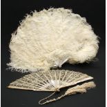 A 19th century mother of pearl and lace fan, together with a similar ostrich feather fan (2)