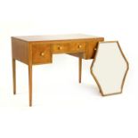 An Edwardian quarter veneered dressing table, with inlaid banding, with a lozenge shaped mirror