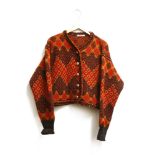 A collection of vintage designer clothes to include a vintage Yves Saint Laurent Aztec wool cardigan