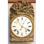 A French eight day Comtoise clock, with embossed brass decoration