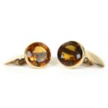 A pair of gold single stone citrine chain link cufflinks, tested as approximately 9ct gold (one