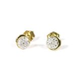 A pair of diamond set circular stud earrings, marked 9k, 0.81g