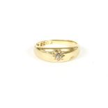 An 18ct gold single stone diamond star set gypsy ring, 4.13g, size K