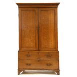 A 19th century oak linen press, as a wardrobe, the dentil cornice over two doors, the base with