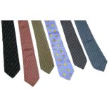 Six designer silk ties, to include a Gucci navy example, a Loewe example with a printed cocktail