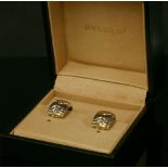 A pair of gold diamond set 'C' shaped earrings, with pavé set eight cut diamonds to a zigzag outer