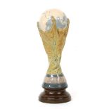 A Lladro porcelain model of the FIFA World Cup trophy, produced in 1978 for Sport-Billy Productions,