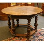 An 18th century circular centre table, on a hexagonal base with turned legs, 123cm diameter, 78cm