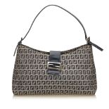 A Fendi Zucchino canvas shoulder bag, featuring a canvas body, flat leather strap, open top with