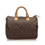 A Louis Vuitton Monogram Speedy 30, the Speedy 30 features the Monogram canvas, vachetta handles and