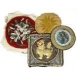 A small quantity of textiles, to include an embroidered circular panel, red ground with lily