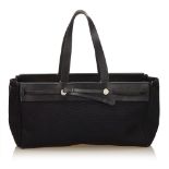 An Hermès Herbag Cabas MM handbag, featuring a canvas body, a top leather detail and straps, top