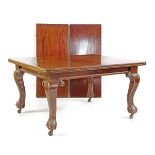 A Victorian mahogany extending dining table with two leaves 122cm wide. 138cm