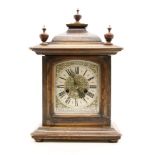 A late 19th century German eight day mantel clock, the silver dial with Roman numerals