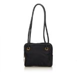 A Celine nylon shoulder bag, featuring a nylon body, rolled leather shoulder straps, top zip