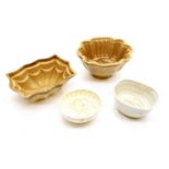 Thirty pottery jelly moulds , including parrot, fruit, beehive, swan, fish etc, tallest 8.5 cm
