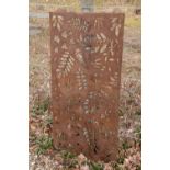 A pierced steel wall panel depicting fern leaves,