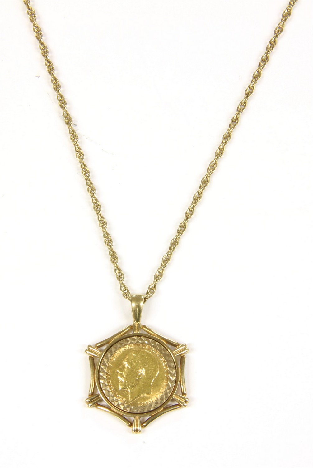 Half sovereign pendant