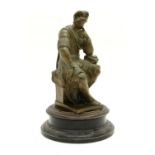 A bronze figure of a seated centurion deep in thought, on associated circular ebonised base, 31cm
