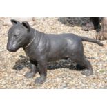 A bronze garden statue modelled as a life size bull terrier