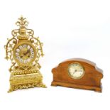 A large brass mantle clock, and an Edwardian inlaid clock