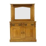 An Arts and Crafts oak mirror back sideboard