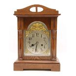 An Edwardian walnut mantel clock. 38cm high