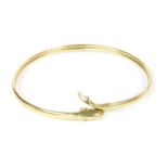 A 9ct gold slave bangle