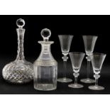 A near pair of Prussian form glass decanters,