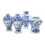Four Dutch Delft blue and white vases, two with signed bases, tallest 26.5cm